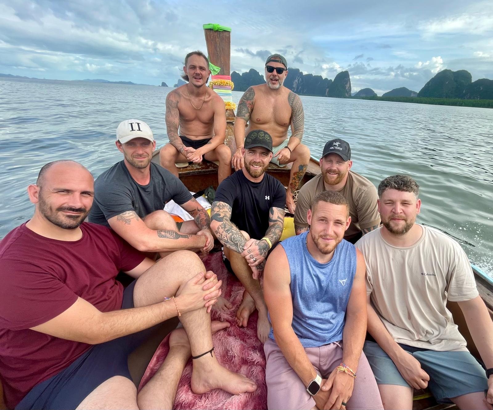 Veterans together on a longtail boat trip through Phang Nga Bay during a Pull Up a Sandbag retreat