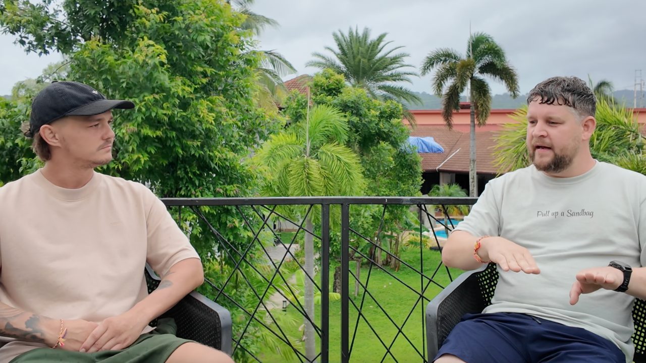Jody, founder of Pull Up a Sandbag, in conversation with a veteran on the retreat terrace in Phuket